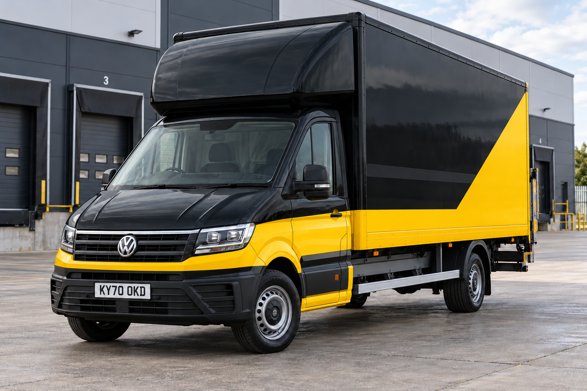 Black-and-yellow Volkswagen Crafter with a UK registration plate at a depot — illustrative vehicle photography